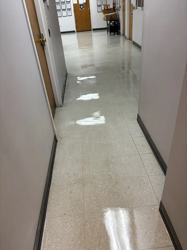Glossy waxed vinyl tile hallway after floor care by G.H. Cleaning Services